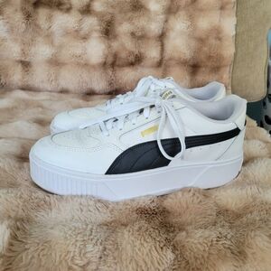 Puma White Sneakers with Black Stripe and Gold Logo